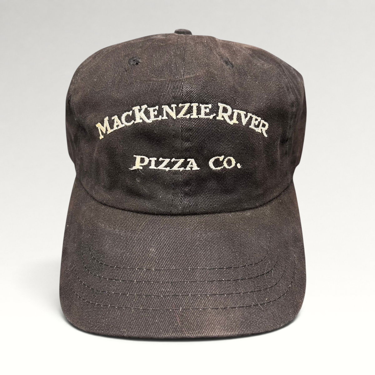 Raree Finds vintage dark brown Mackenzie River Pizza Co. strapback hat with white embroidered arched lettering