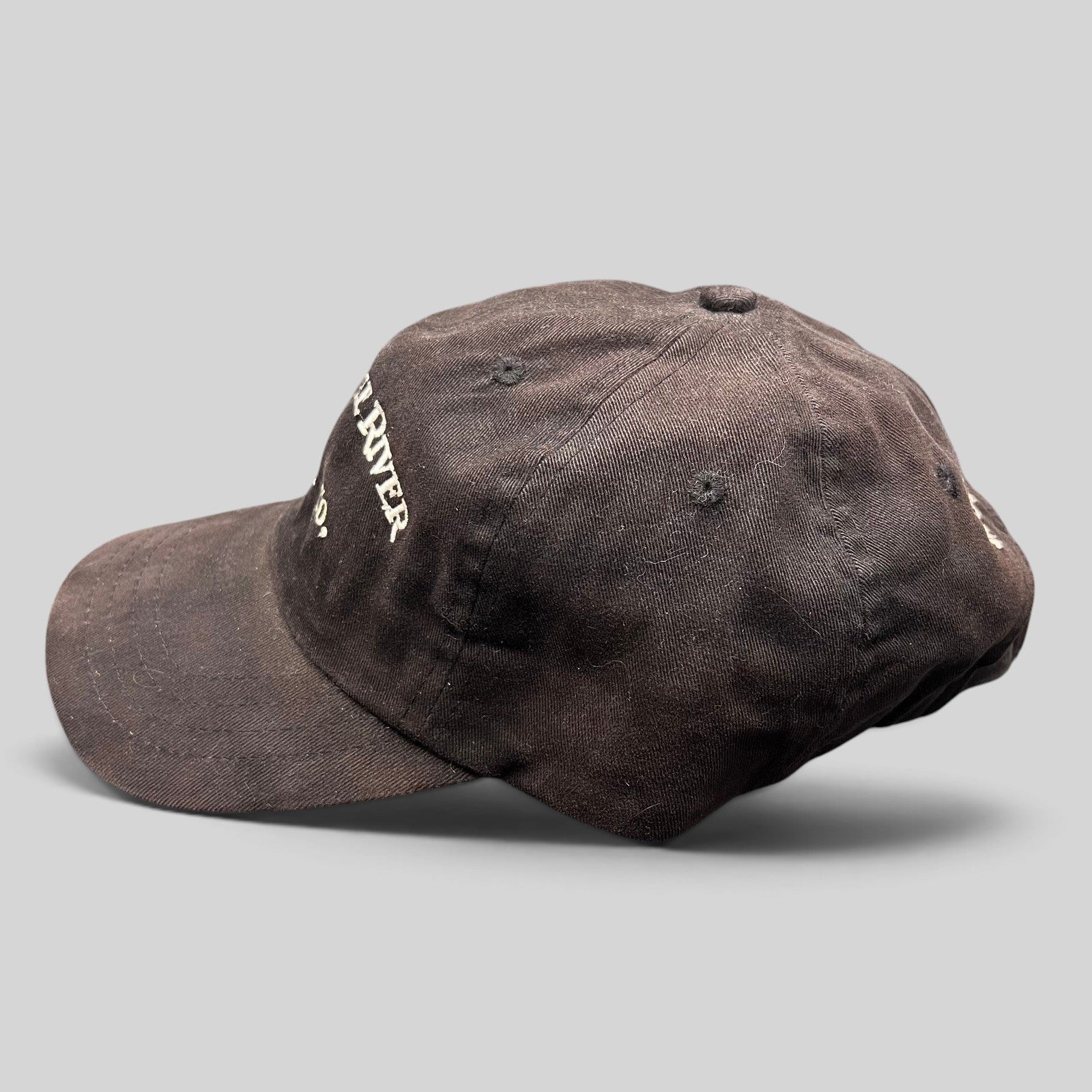 Raree Finds vintage dark brown Mackenzie River Pizza Co. strapback hat with white embroidered lettering.