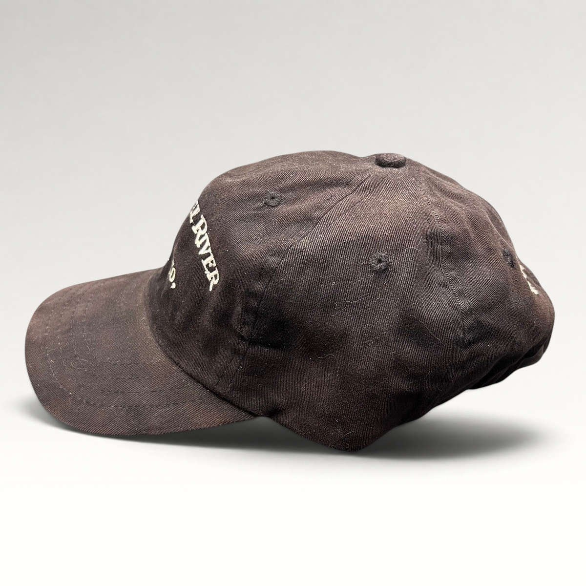 Raree Finds vintage dark brown Mackenzie River Pizza Co. strapback hat with white embroidered lettering.
