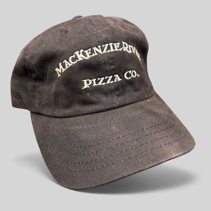 Raree Finds vintage dark brown Mackenzie River Pizza Co. strapback cap with white embroidered lettering.