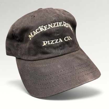 Raree Finds vintage dark brown Mackenzie River Pizza Co. strapback cap with white embroidered lettering.