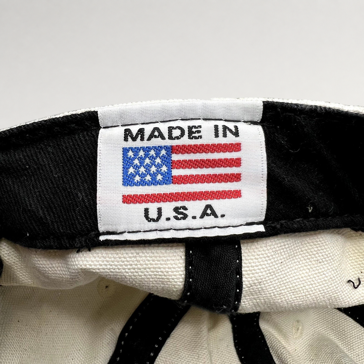 Raree Finds vintage Y2K Ojai Surf Club hat interior label showing Made in USA flag tag on natural canvas material