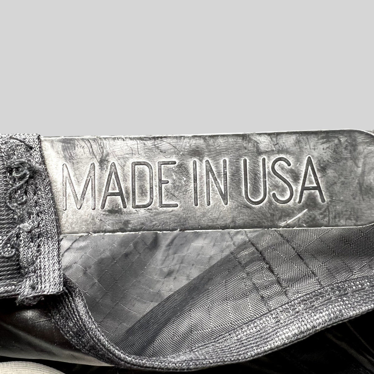 Raree Finds vintage snapback hat interior label showing Made in USA text on black ripstop nylon fabric