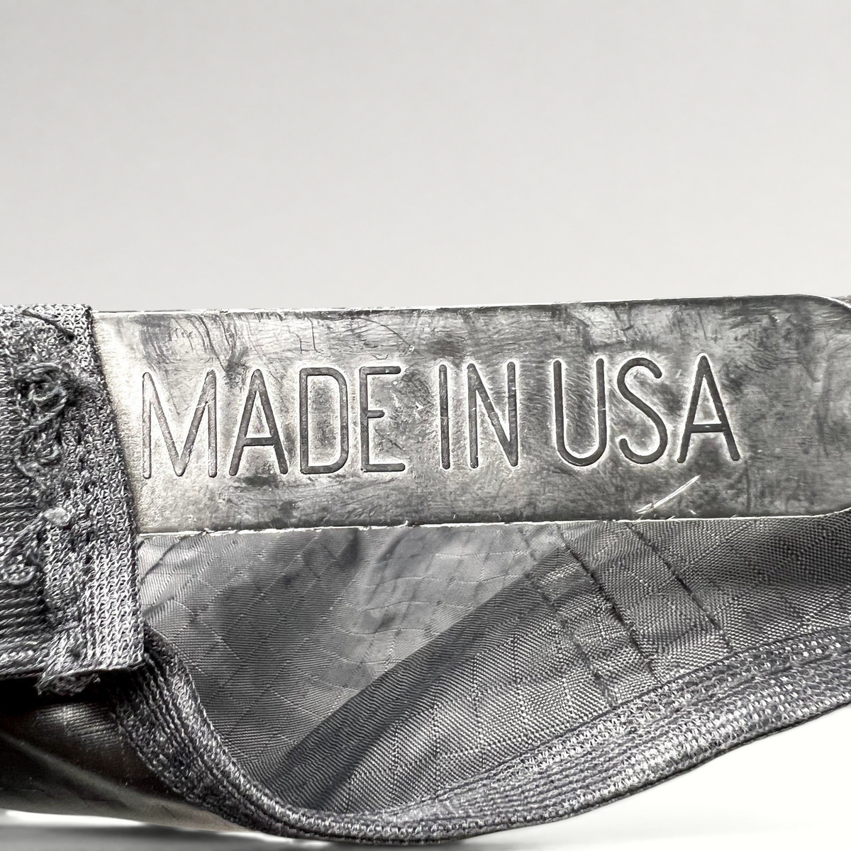 Raree Finds vintage snapback hat interior label showing Made in USA text on black ripstop nylon fabric