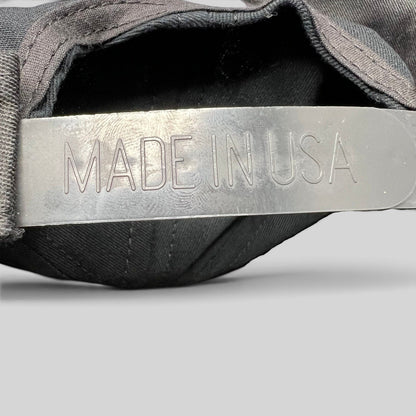 Raree Finds vintage Competition Headwear snapback hat showing the Made in USA stamp on the plastic adjustable strap.