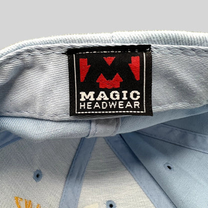 Raree Finds Magic Headwear brand label inside a light blue vintage aviation strapback hat