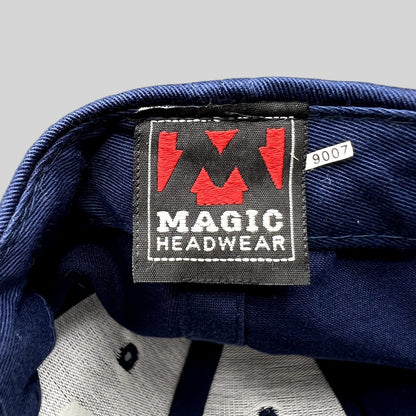 Raree Finds Magic Headwear navy blue hat interior label with red logo and white text on a black woven tag