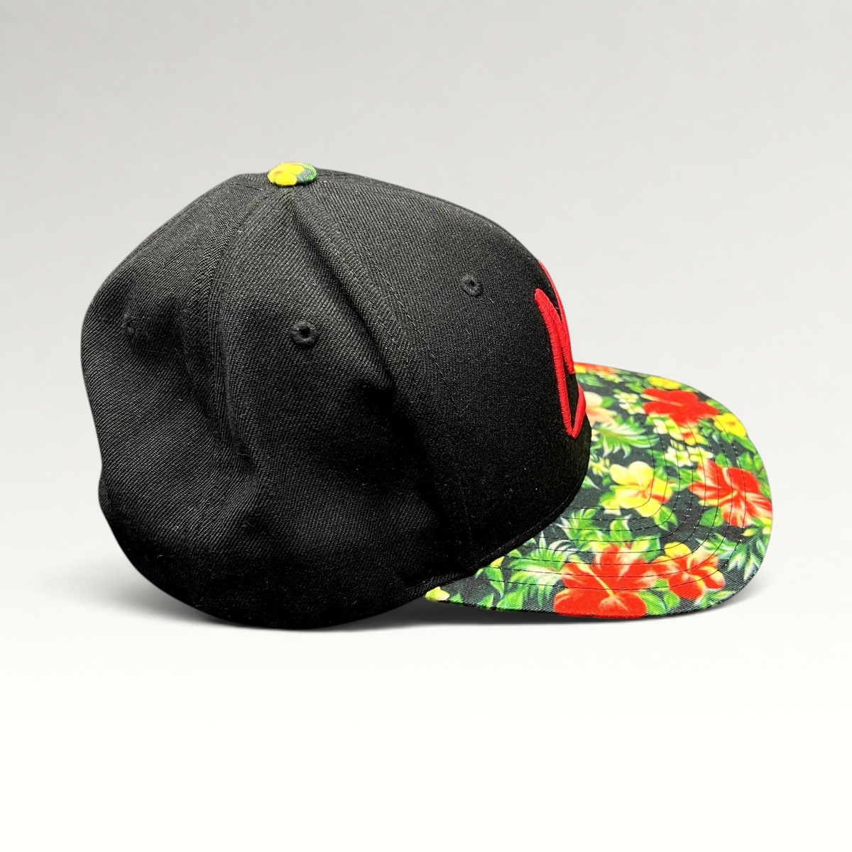 Raree Finds Mammoth Mountain black snapback hat with a red embroidered logo and vibrant tropical floral print brim