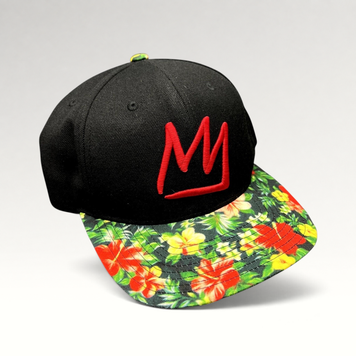 Raree Finds Mammoth Mountain black snapback hat with a red embroidered logo and vibrant tropical floral print brim.