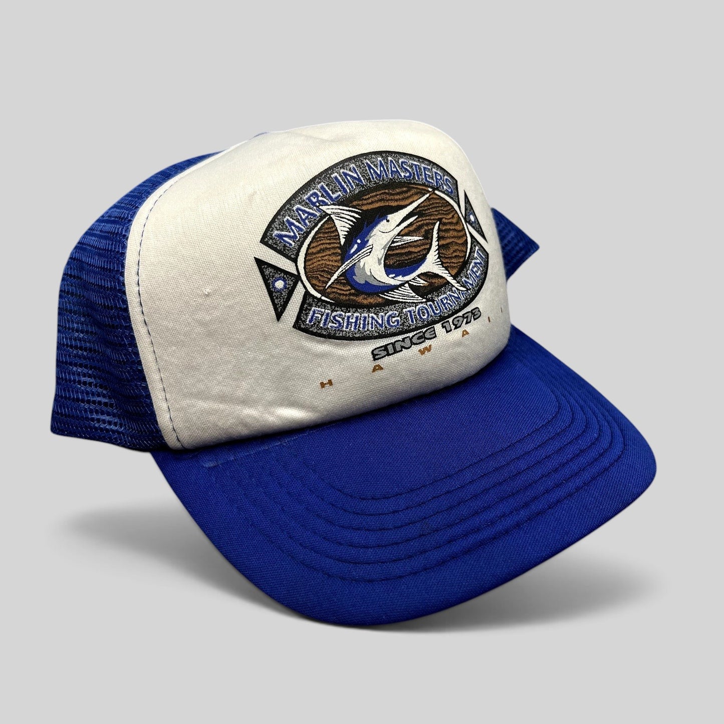 Raree Finds vintage Marlin Masters Hawaii fishing tournament snapback trucker hat with blue mesh and white foam front.