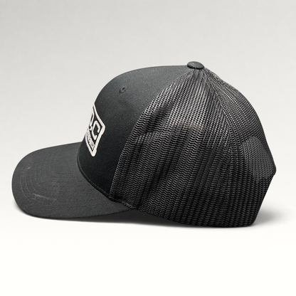 Raree Finds black Marvel Damage Control West trucker snapback hat with mesh back panels and adjustable closure