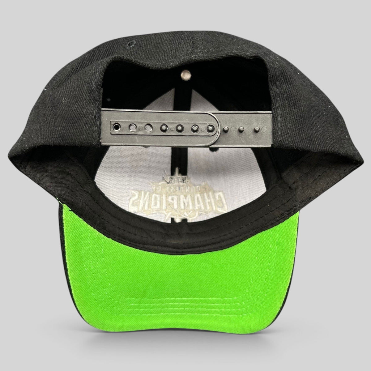 Raree Finds Marvel Contest of Champions snapback hat featuring a black crown and vibrant neon green undervisor