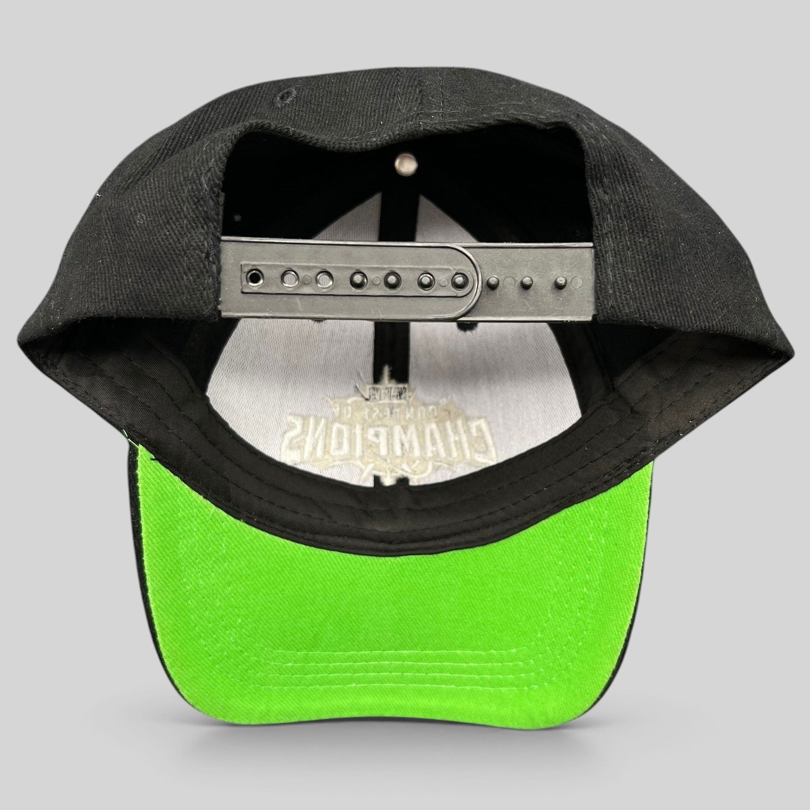 Raree Finds Marvel Contest of Champions snapback hat featuring a black crown and vibrant neon green undervisor