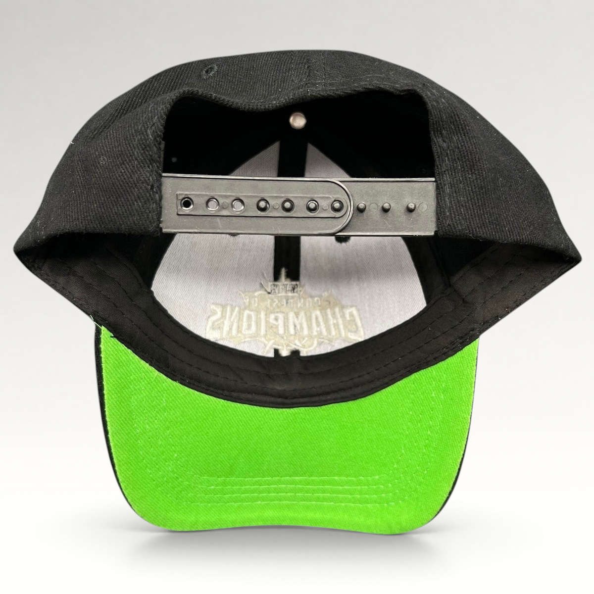 Raree Finds Marvel Contest of Champions snapback hat featuring a black crown and vibrant neon green undervisor