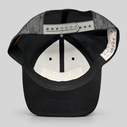 Raree Finds Marvel Damage Control trucker hat showing the interior mesh lining and adjustable black snapback closure.