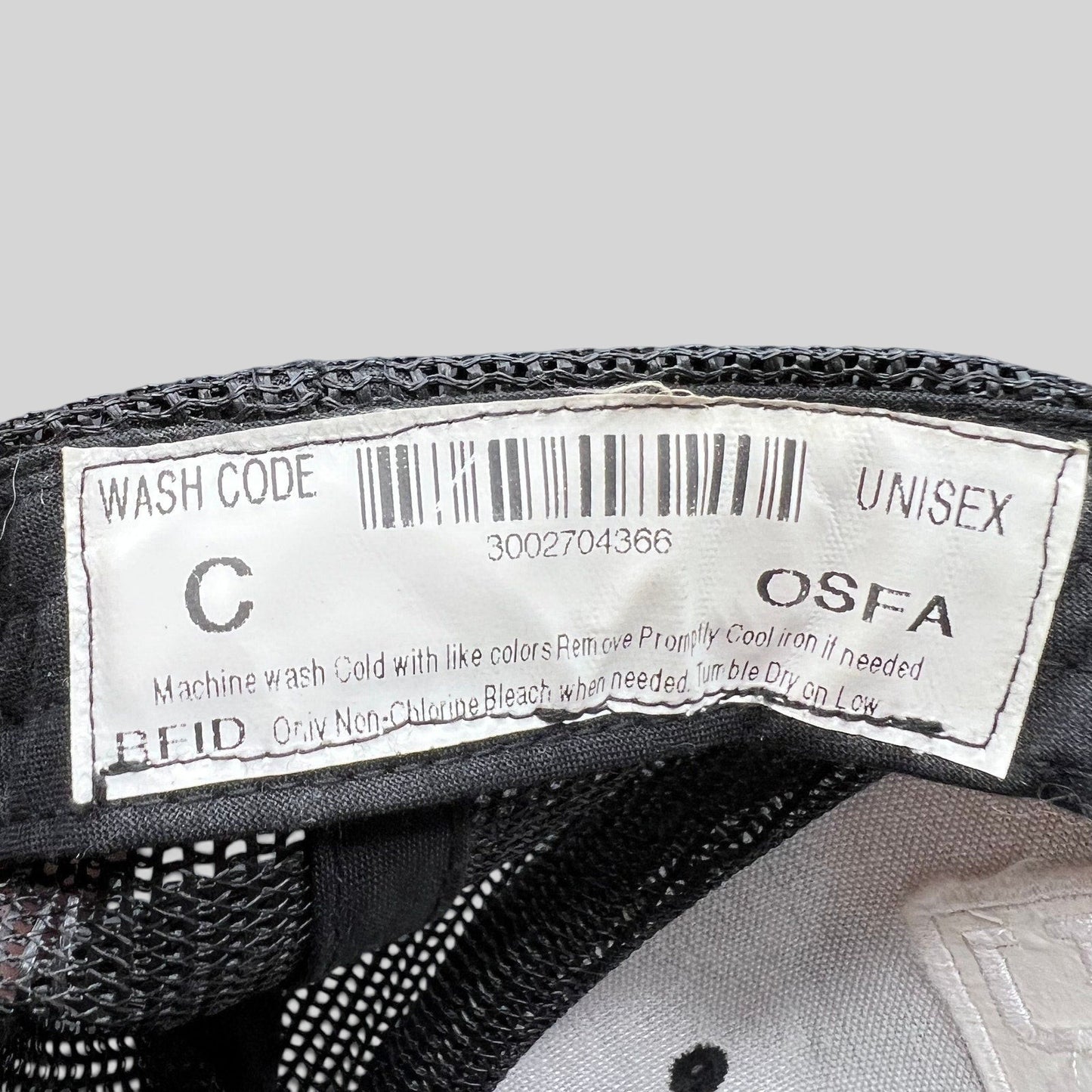 Raree Finds Marvel Damage Control trucker hat interior care label with barcode and OSFA sizing information