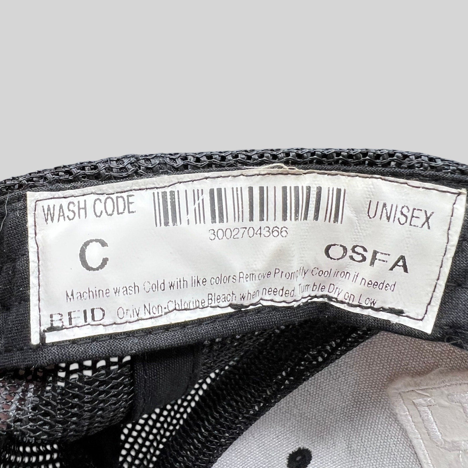 Raree Finds Marvel Damage Control trucker hat interior care label with barcode and OSFA sizing information