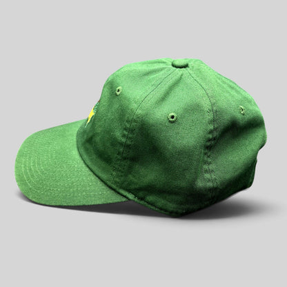Raree Finds green Masters Tournament cotton strapback hat with embroidered Augusta National logo, side profile view.
