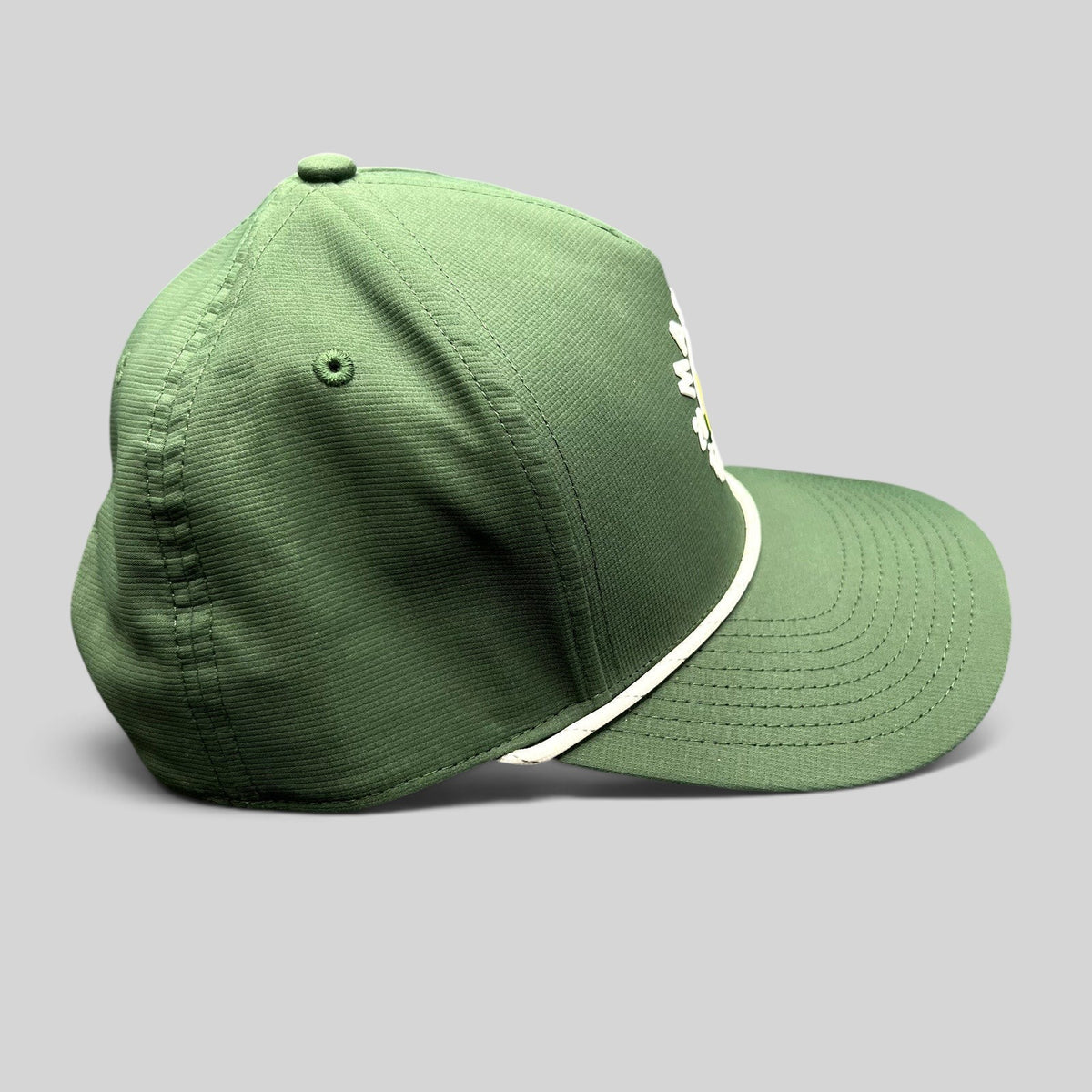Raree Finds 2024 Masters Tournament green snapback golf hat with white rope detail and structured performance fabric