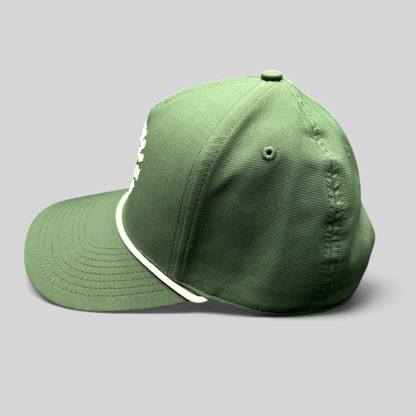 Raree Finds 2024 Masters Tournament green snapback golf hat with white rope detail on the bill, side view.
