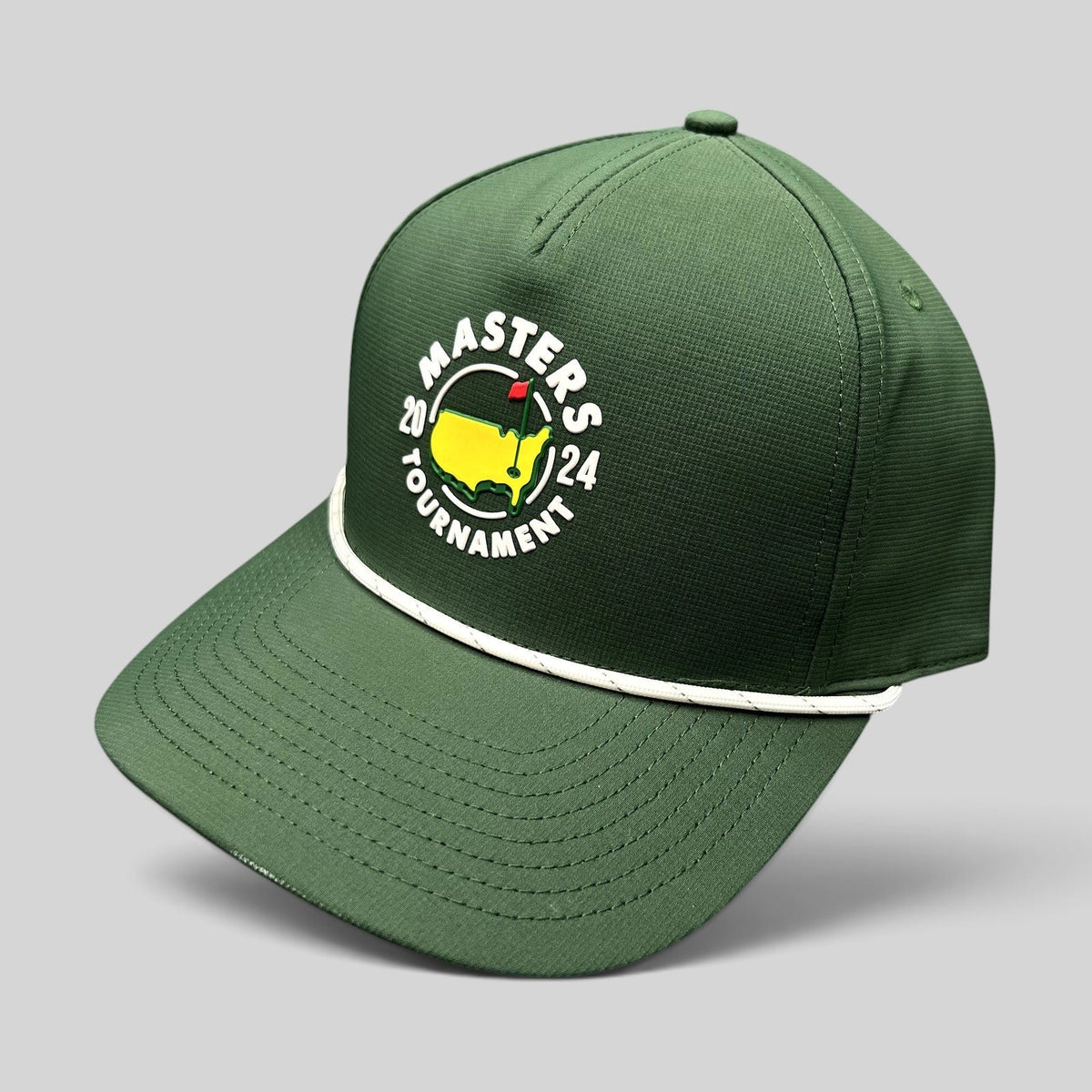 Raree Finds 2024 Masters Tournament green snapback golf hat with white rope detail and official logo on black background
