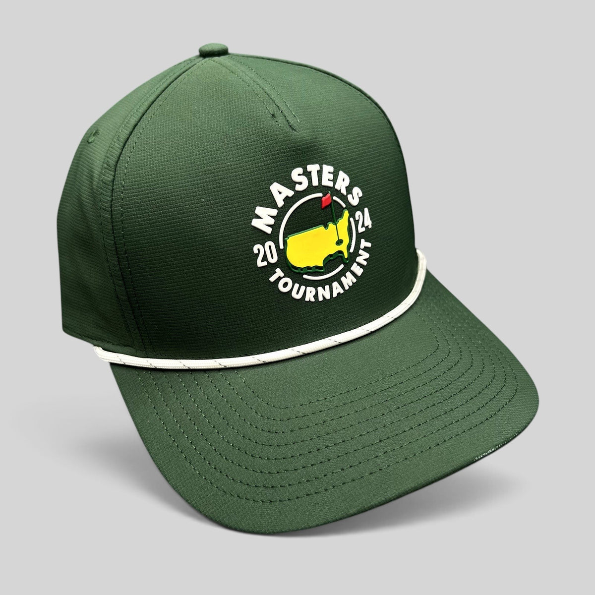 Raree Finds 2024 Masters Tournament green snapback golf hat with white rope detail and official logo on black background