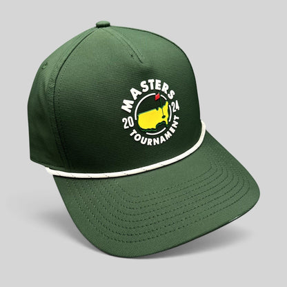 Raree Finds 2024 Masters Tournament green snapback golf hat with white rope detail and official logo on black background