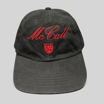 Raree Finds McCall Motor Works black strapback hat with red script embroidery and crest on the front crown
