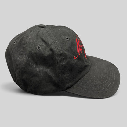 Raree Finds McCall Motor Works black strapback hat with red script embroidery and a matching red underbrim