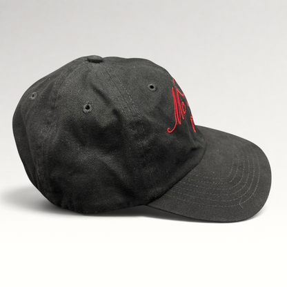 Raree Finds McCall Motor Works black strapback hat with red script embroidery and a matching red underbrim
