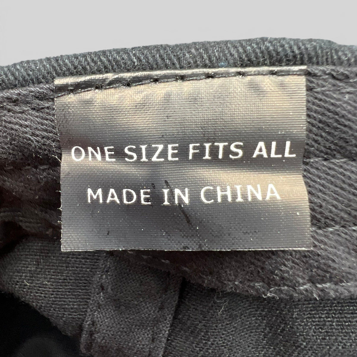Raree Finds McCall Motor Works strapback hat interior tag showing one size fits all and made in China label
