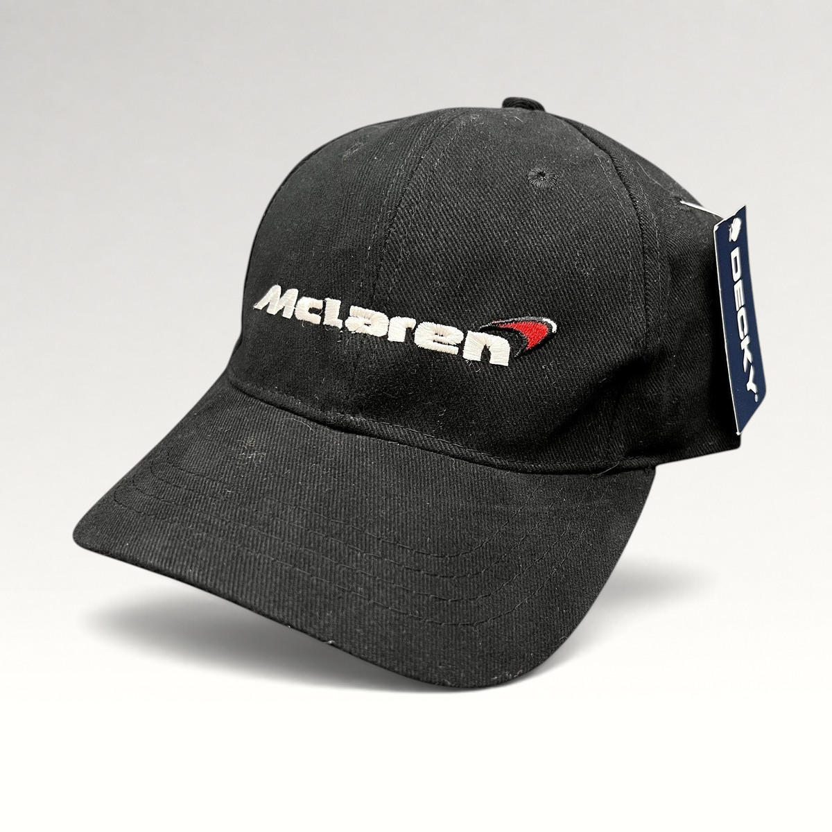 Raree Finds black McLaren cotton strapback hat with embroidered logo and Decky brand tag on a white background