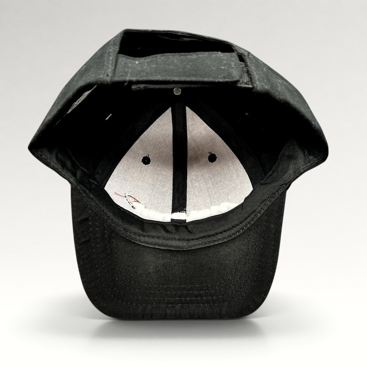 Raree Finds black McLaren cotton strapback hat showing the interior six-panel construction and adjustable velcro strap