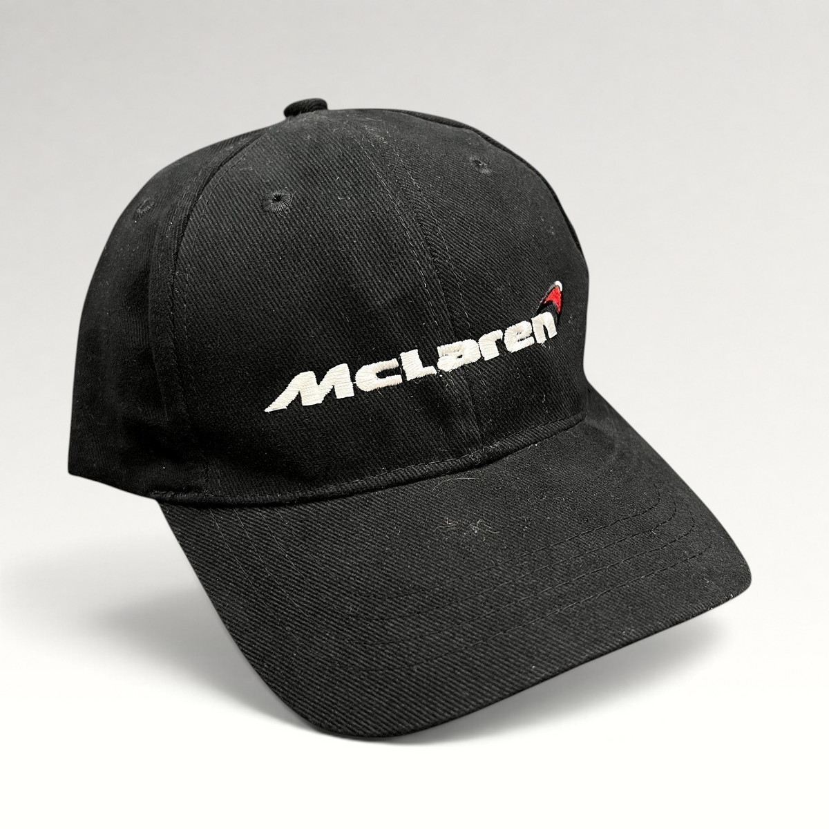 Raree Finds black cotton McLaren strapback hat with white and red embroidered logo on a six-panel low-profile cap.