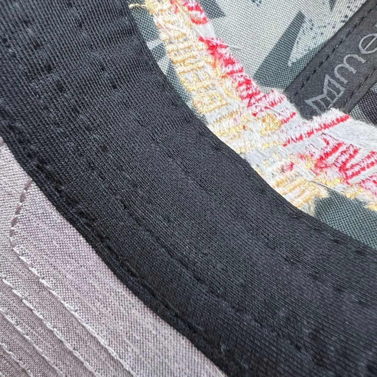 Raree Finds Melin Leave the World Behind crew hat interior detail showing black sweatband and patterned lining