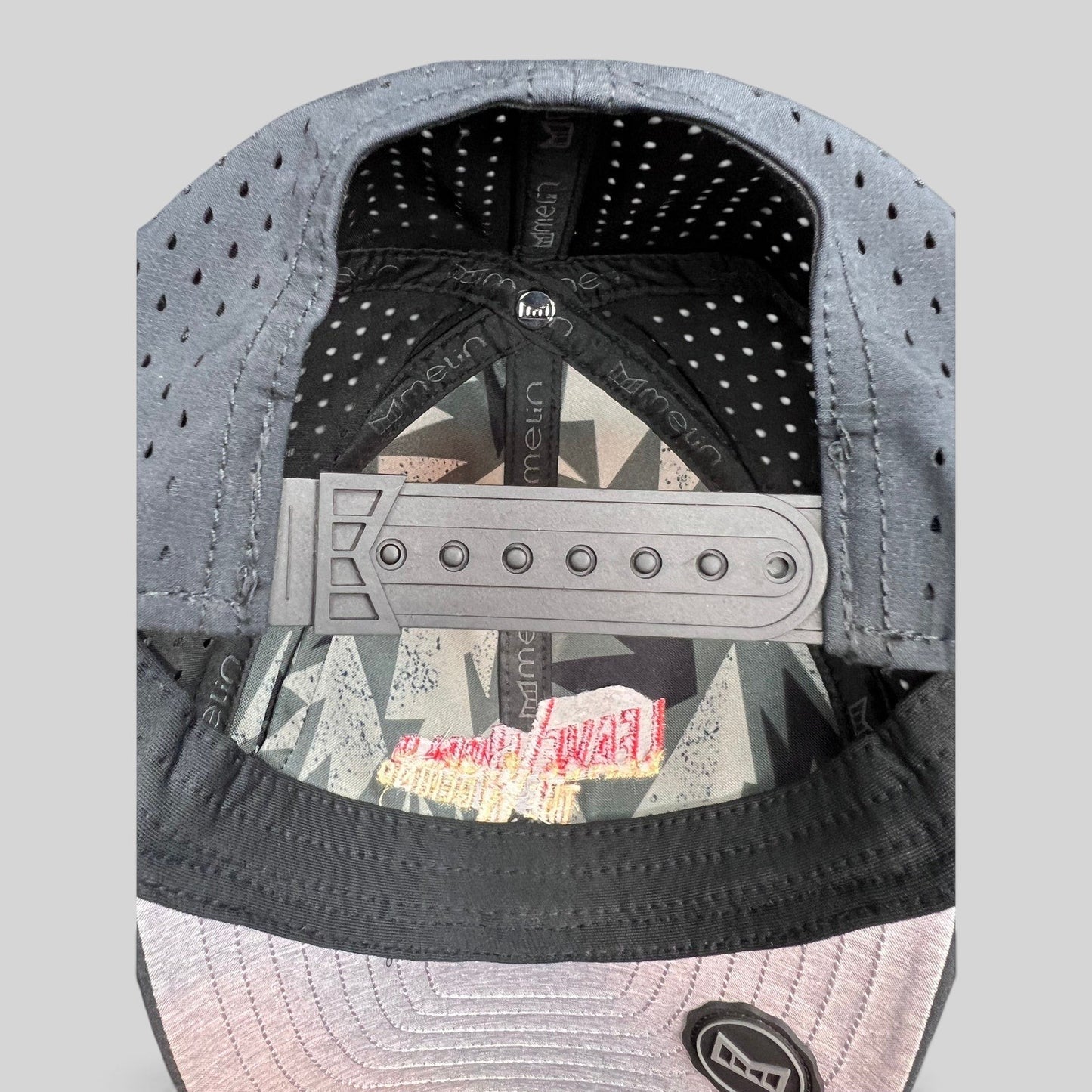 Raree Finds Melin Leave the World Behind crew hat showing the interior snapback closure and branded lining