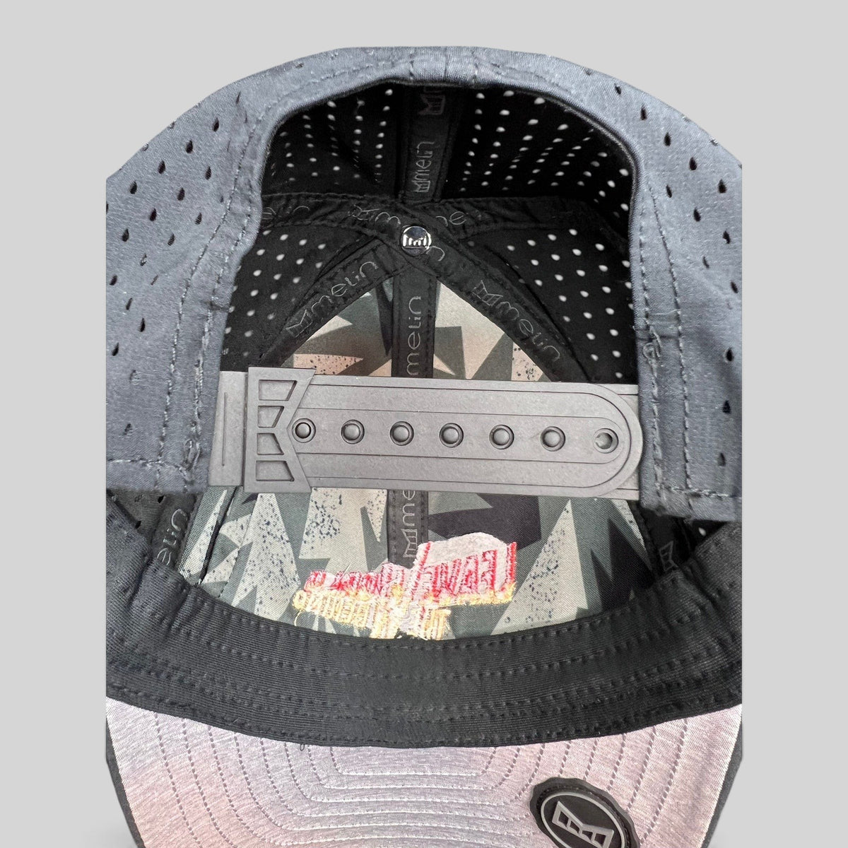 Raree Finds Melin Leave the World Behind crew hat showing the interior snapback closure and branded lining
