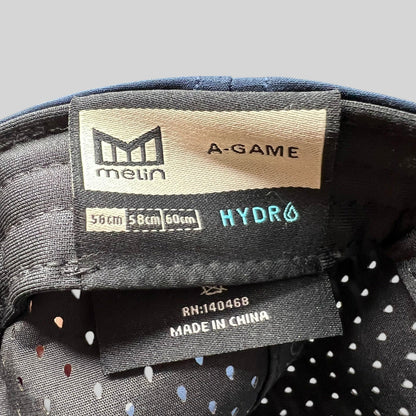 Raree Finds Melin A-Game HYDRO snapback hat interior label showing size and performance fabric details