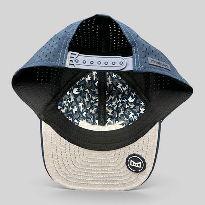 Raree Finds Melin Hydro A-Game navy snapback hat showing the interior perforated panels and patterned lining