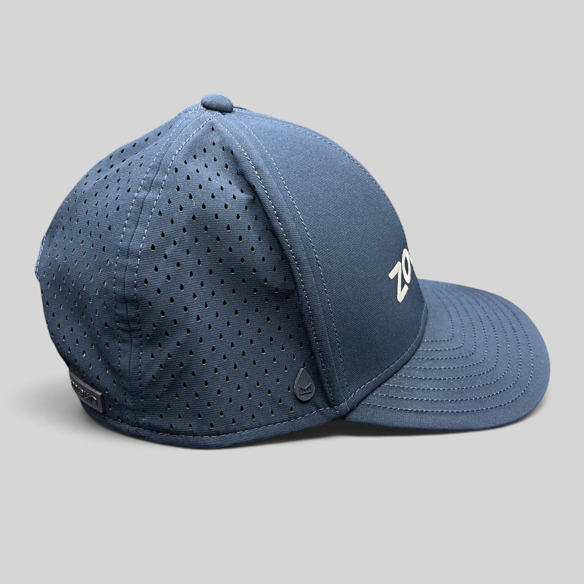 Raree Finds navy Melin Hydro A-Game snapback hat with laser-perforated side panels and Zoom embroidery