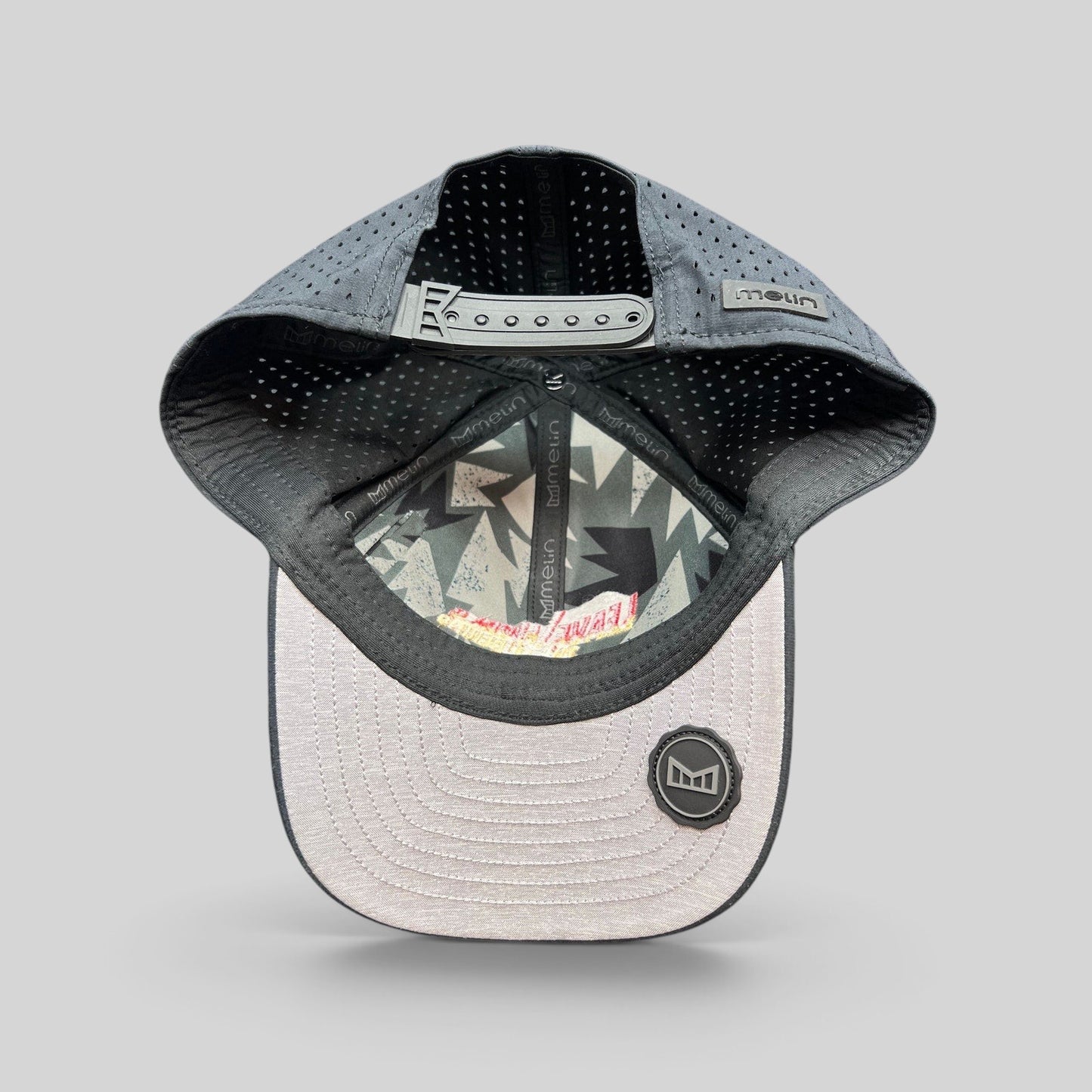 Raree Finds Melin Leave the World Behind snapback hat featuring a grey perforated crown and light grey brim