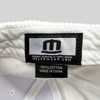 Raree Finds Melonwear white corduroy hat interior label showing 100 percent cotton material and brand branding