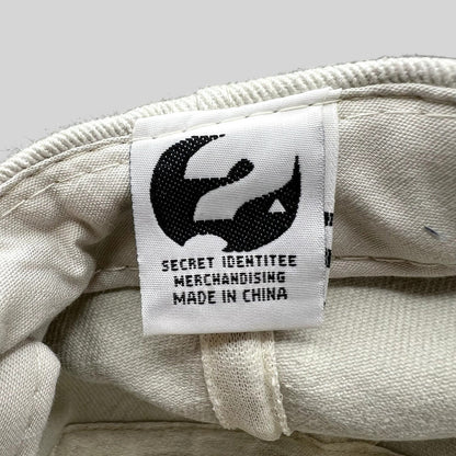 Raree Finds vintage Melrose Place hat interior tag with Secret Identitee Merchandising logo and Made in China text.