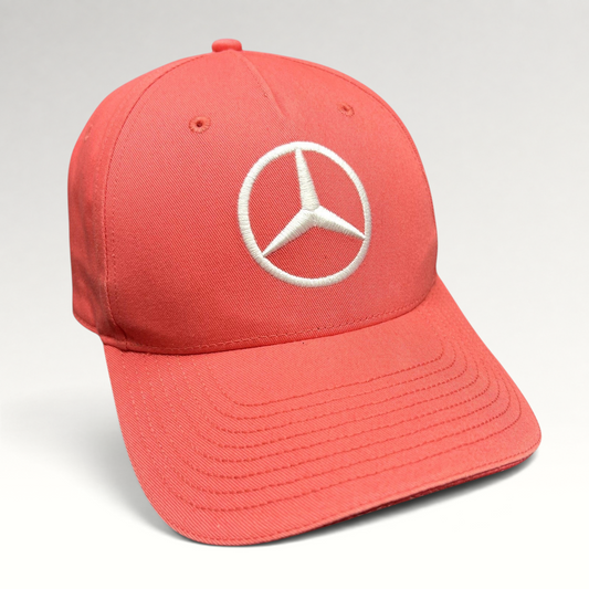 Raree Finds coral pink Mercedes AMG Petronas strapback hat with a large white embroidered Mercedes logo on the front.