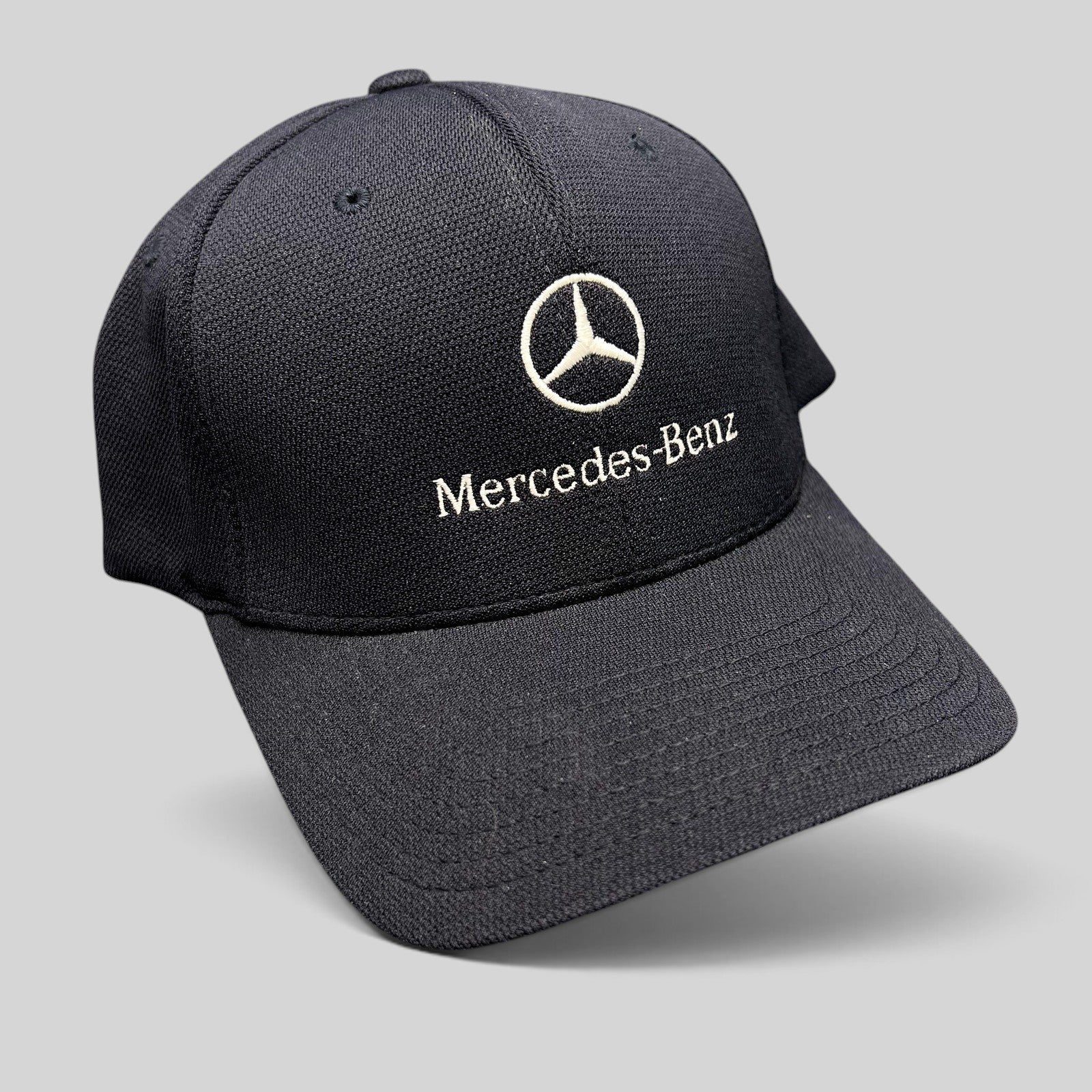 Raree Finds navy blue Mercedes-Benz Flexfit cap with white embroidered logo and script on a structured crown