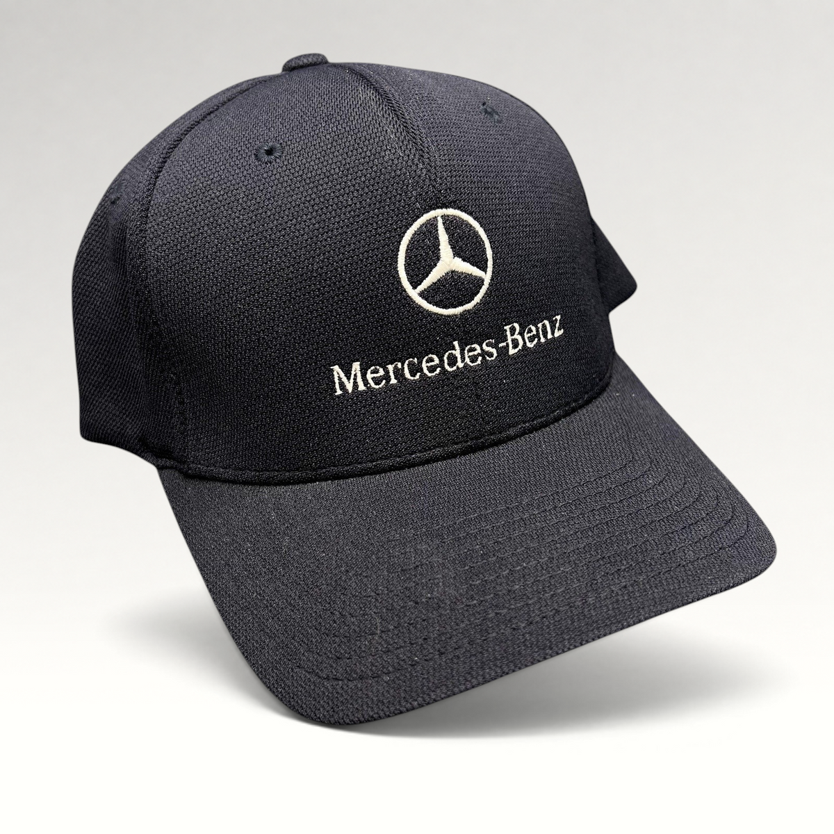 Raree Finds navy blue Mercedes-Benz Flexfit cap with white embroidered logo and script on a structured crown