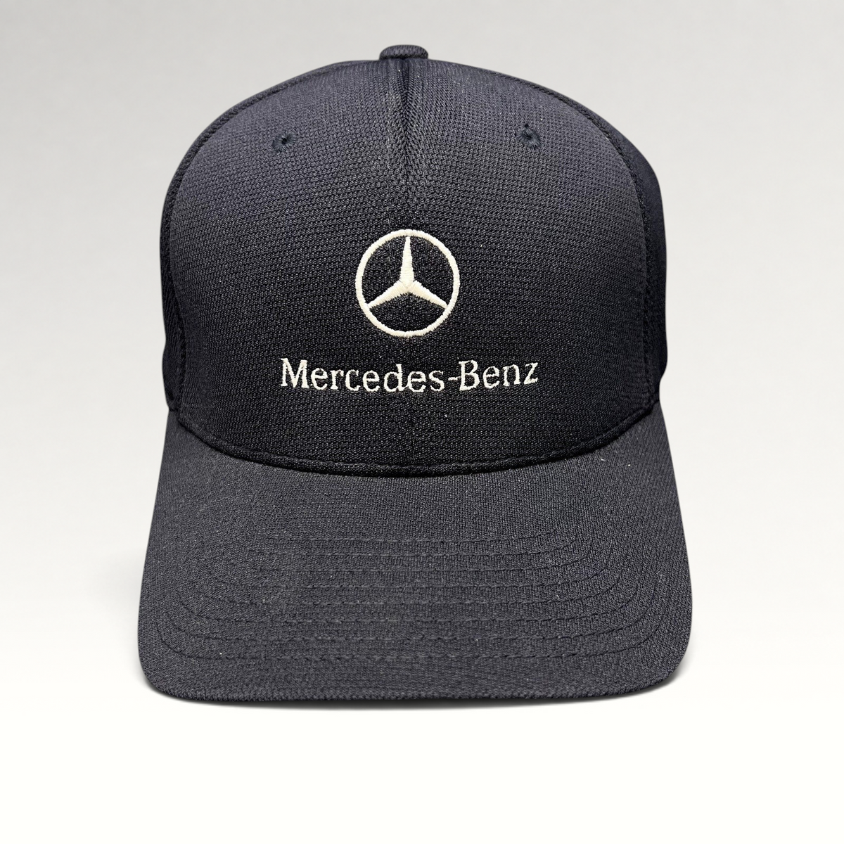 Raree Finds navy blue Mercedes-Benz Flexfit cap with white embroidered logo and script on a structured crown