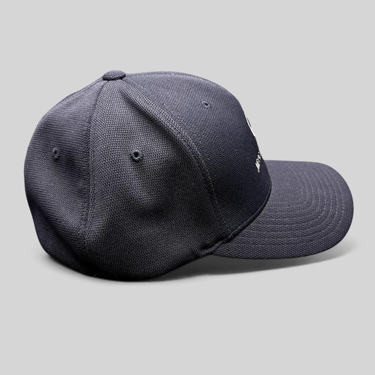 Raree Finds navy blue Mercedes-Benz Flexfit hat with embroidered logo and structured crown, side profile view.