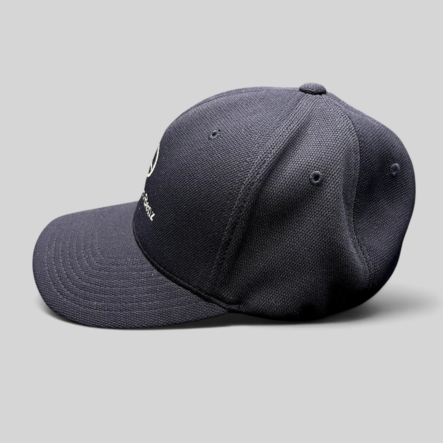 Raree Finds navy blue Mercedes-Benz Flexfit hat with embroidered logo and structured crown, side profile view.