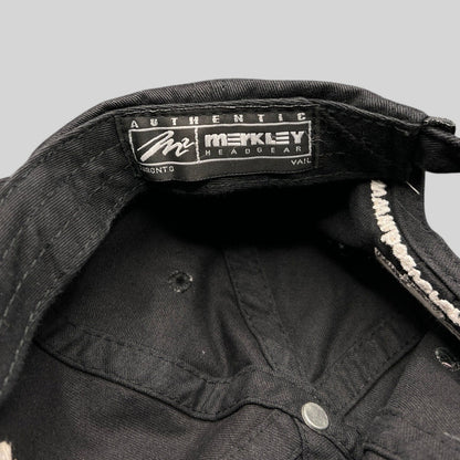 Raree Finds black cotton hat interior showing the Merkley Headgear authentic label and unstructured 6-panel stitching.